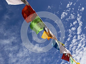Nepalese prayer flags against the blue sky.