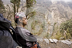Nepali guide resting on the way to abc photo