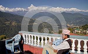 Nepali men and the anapurna mountain range