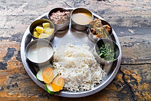 Nepali Thali meal set with curry mutton photo