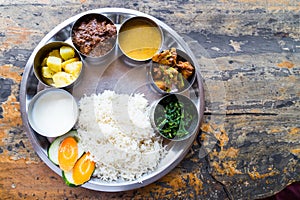 Nepali Thali meal set with curry mutton photo