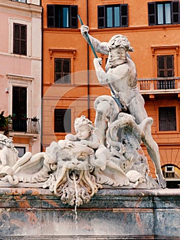 Neptune Fontain details in Navona Square in Rome Italy. photo