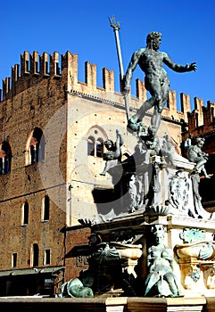 Neptune Fountain illuminated by the morning sun in the city center in Bologna in Emilia Romagna (Italy)