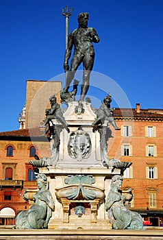 Neptune Fountain illuminated by the morning sun in the city center in Bologna in Emilia Romagna (Italy)