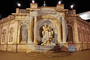 Neptune Fountain, at night - landmark attraction in Vienna, Austria.