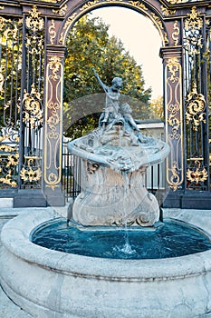Neptune Fountain at the Place Stanislas in Nancy, France, departement Lorraine, golden gate