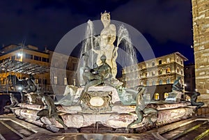 Neptune fountain on Signoria square at night, Florence, Italy