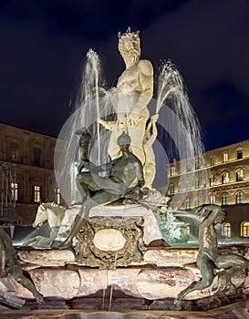 Neptune fountain on Signoria square at night, Florence, Italy