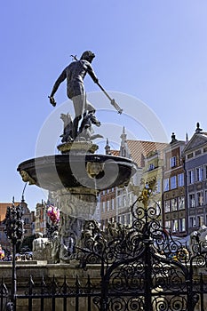 Neptune`s Fountain in front of vintage architecture of Old Town - Long Market, Gdansk, Tricity, Poland