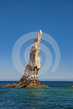 Neptunes Finger is rock formation that is easy to spot along the cliffs outside the marina in Cabo San Lucas photo