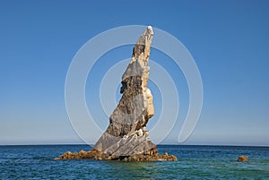 Neptunes Finger is rock formation that is easy to spot along the cliffs outside the marina in Cabo San Lucas photo