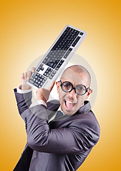Nerd businessman with computer keyboard against