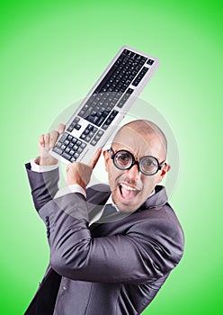 Nerd businessman with computer keyboard against