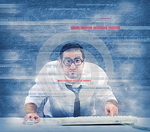Nerd computer programmer works on a virus program