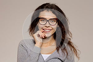 Nerd girl in glasses and with brackets on teeth. Positive, excel