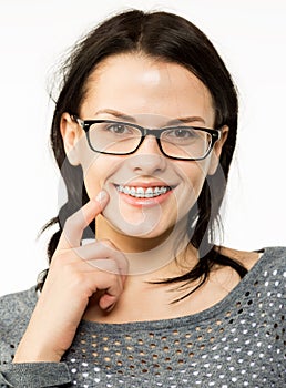 Nerd girl in glasses and brackets on teeth. Positive, excellent student woman hipster.