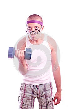 Nerd in glasses with dumbbell trains