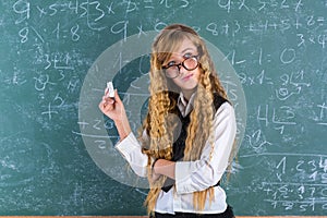 Nerd pupil blond girl in green board schoolgirl