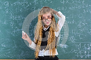 Nerd pupil blond girl in green board schoolgirl