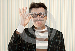 Nerd silly crazy myopic glasses man funny gesture photo