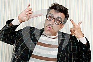 Nerd silly crazy myopic glasses man funny gesture photo