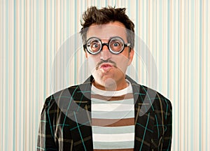 Nerd silly crazy myopic glasses man funny gesture photo