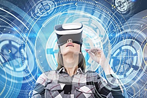 Nerd woman in VR glasses, futuristic interface