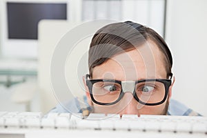 Nerdy businessman working on computer