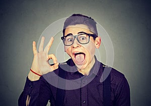 Nerdy funny man showing ok sign