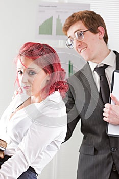 Nerdy man bothering an intern woman