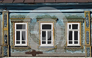 Nerekhta town, Kostroma Oblast, Russia, May 26, 2021:  Carved wooden platbands on windows of old wooden house on Krasnoarmeyskaya