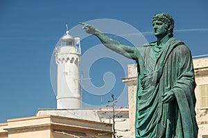 Nero statue and lighthouse in Anzio, Italy photo