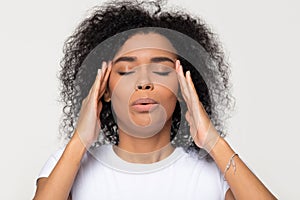 Nervous african woman breathing calming down trying to relieve stress photo