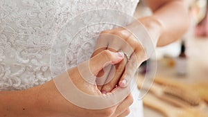 Nervous, anxiety and scared bride on wedding looking at her ring in a room. Thoughtful young woman thinking about future