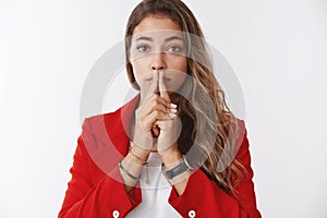 Nervous attractive serious-looking young businesswoman waiting important results worried holding palms together touching