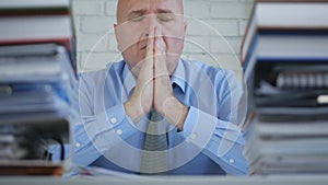 Nervous Businessman Image Making a Pray Gestures Worried and Troubled.