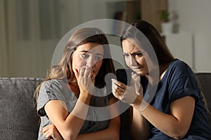 Nervous friends waiting online news in a smart phone