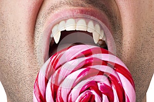 Nervous Hunger Man Fangs Bite Large Swirly Lollipop photo