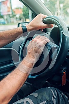 Nervous male driver pushing car horn in traffic rush hour