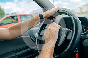 Nervous male driver pushing car horn in traffic rush hour photo