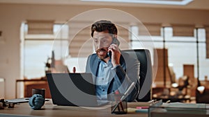 Nervous man answering call at computer desk workplace. Businessman screaming