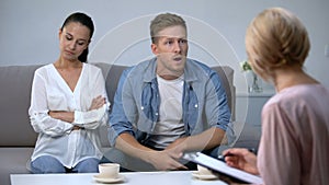 Nervous man blaming wife at psychologist reception, risk of divorce, problem