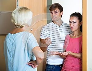 Nervous neighbors coming to old lady with complains