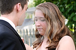 Nervous Prom Girl Fixing Boutonniere