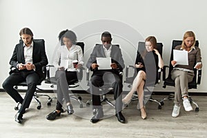 Nervous stressed job applicants preparing for interview waiting