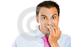 Nervous and stressed man biting fingernails