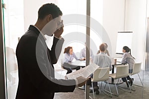 Nervous stressed sweaty businessman speaker feel public speaking fear photo