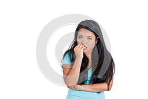 A nervous teenager biting her nails