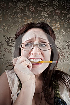 Nervous Woman Chewing on a Pencil