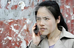 Nervous woman talking on her cellphone